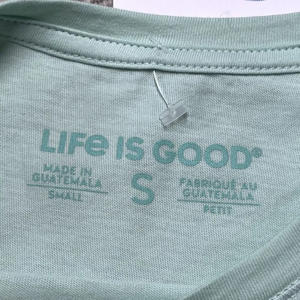NWT LIFE IS GOOD Beach T-shirt Women’s Small Ocean Lake Sun I Like It Here Green